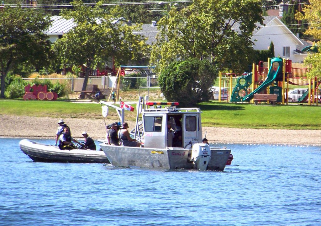 The Ralstons meet on the water with an RCMP dingy after locating the body of Samen Pirzadeh-Tabaei-Zavareh, 34, of North Vancouver on Sunday. (Diana Anderson) 