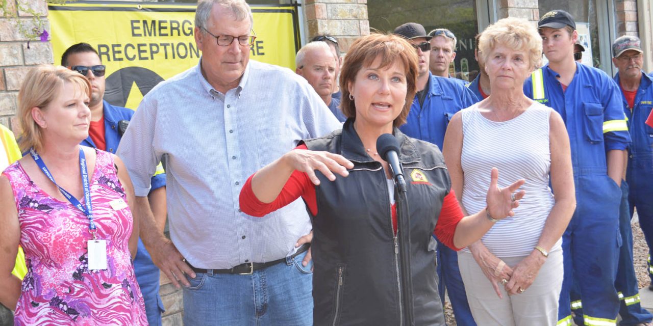Premier praises volunteers during visit to Oliver, while condemning drone operator