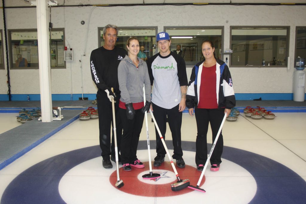 Skip Leo ‘Lucky’ Buholzer’s squad came out on top to claim the top prize in the 2015 Osoyoos Mid-Summer Bonspiel this past weekend. Buholzer was joined by his children (from left) Brittany, Justin and Steffany. Buholzer’s wife Carol also filled in during two games as they went undefeated in six games to win the popular bonspiel. (Keith Lacey photo)