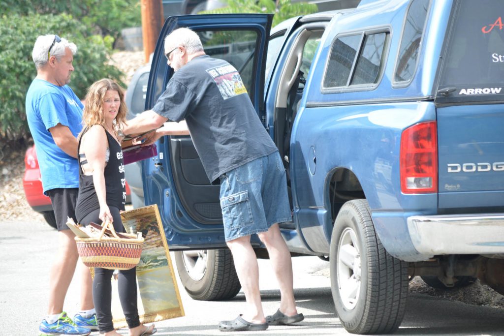 Members of the Amos family, who live on Spartan Street in Oliver, didn’t have much time to pack their belongings after fire broke out in their neighbourhood Friday evening. (Lyonel Doherty photo)
