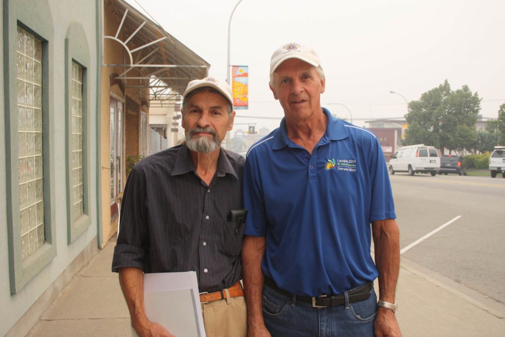 Stephen Kirkham (left) and Les Jackman are members of the Rock Creek Lions Club.. They opened a bank account at the Osoyoos branch of the CIBC on Monday to help raise funds to help assist the numerous wilidfire victims from Rock Creek. The Osoyoos Credit Union has also opened an account to allow local residents to assist wlidfire victims from across the region. On Wednesday, Sept. 2, a community fundraising barbecue will be held in the parking lot of the Best Western Hotel in Osoyoos between 11 a.m. and 2 p.m., with all proceeds again going to wildfire victims. (Keith Lacey photo)