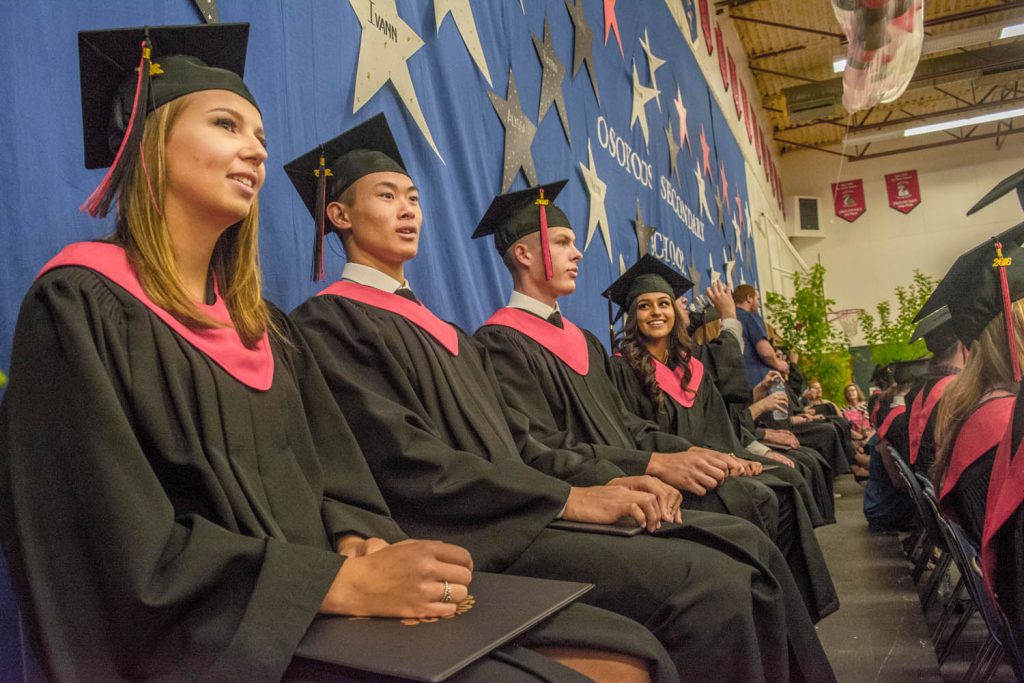 The 2016 grad class at Osoyoos Secondary School sits at the front during last Wednesday's ceremony. (Dan Walton photo)
