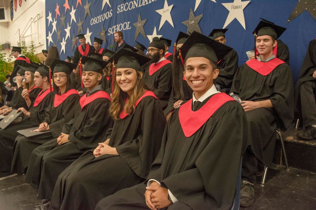 The 2016 grad class at Osoyoos Secondary School sits at the front during last Wednesday's ceremony. (Dan Walton photo)