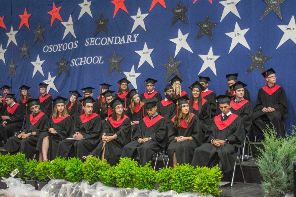 The 2016 grad class at Osoyoos Secondary School sits at the front during last Wednesday's ceremony. (Dan Walton photo)
