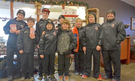 Peewee hockey players give back to the community at unique popcorn fundraiser