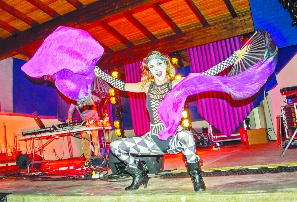 There weren’t just flames being fanned during the Fire Show by Nadine and Neil, when circus-themed dancers grooved to the tunes of DJ MAST3RBLAST3R with their flow toys. (Dan Walton photo)