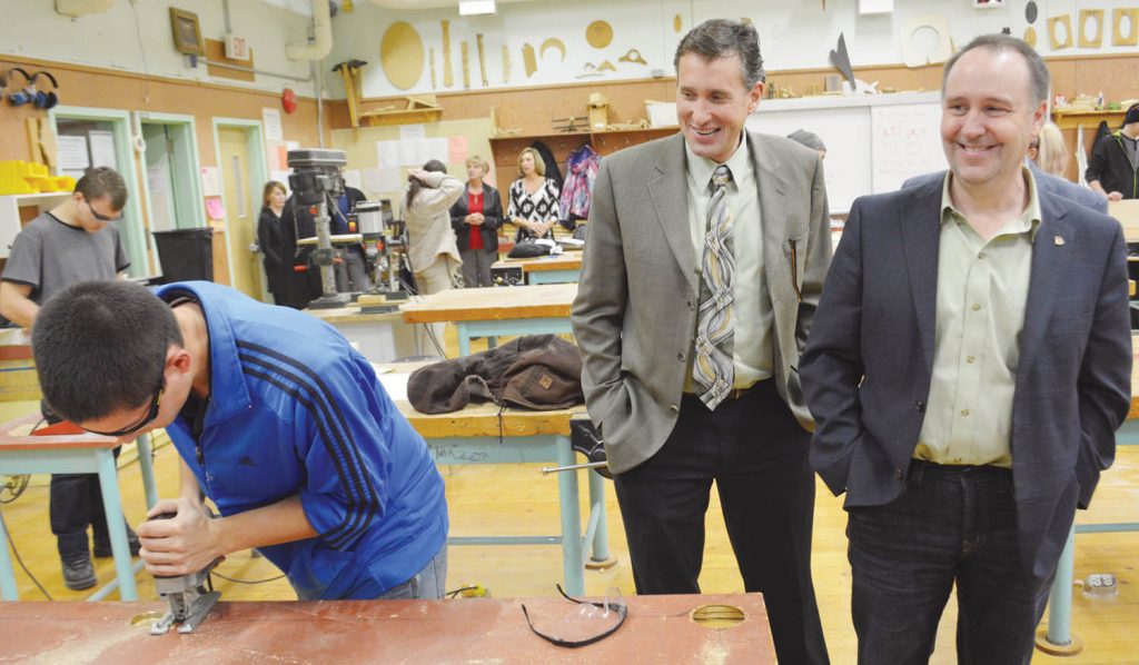 Minister of Education Mike Bernier (far right) joined Southern Okanagan Secondary School principal Marcus Toneatto during a visit to shop class during his visit to the region last Thursday. Bernier hopes to visit every school district in the province in the coming months. (Trevor Nichols photo)