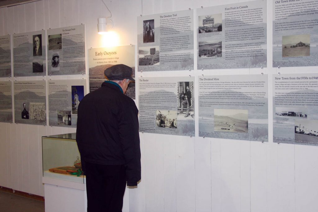 An unidentified man looks at the wall featuring interesting facts about Osoyoos at the Osoyoos Museum's open house. (Keith Lacey photo)