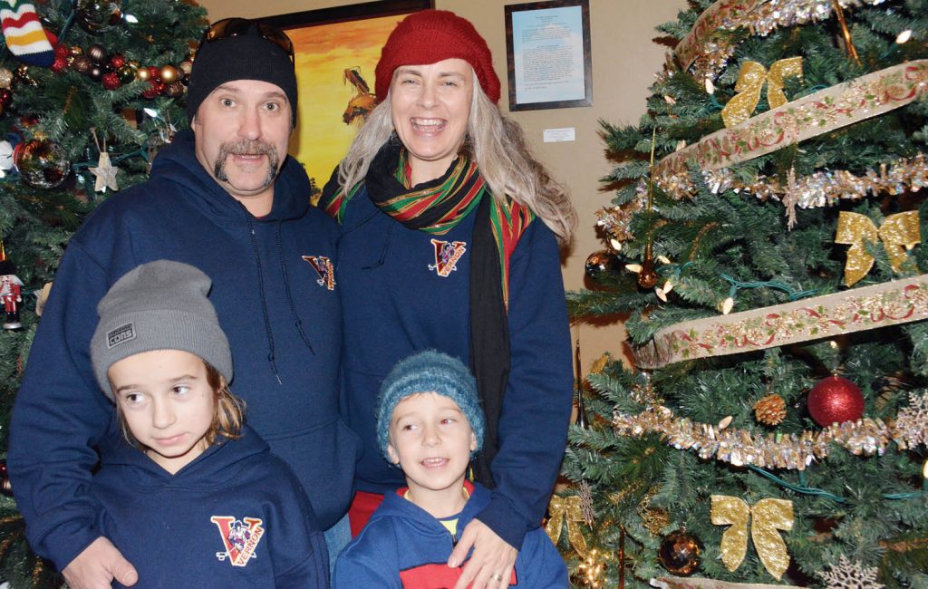 Many families were on hand this past Saturday afternoon as the sixth annual Nk’ Mip Resort Festival of Trees kicked off. Jeff Earl and Scarlet Poworoznik have a laugh with kids Kai (left) and Keenan Earl. The family was visiting from Vernon to attend the South Okanagan Minor Hockey Association Novice Tournament when they decided to check out the festival. (Lyonel Doherty photo)