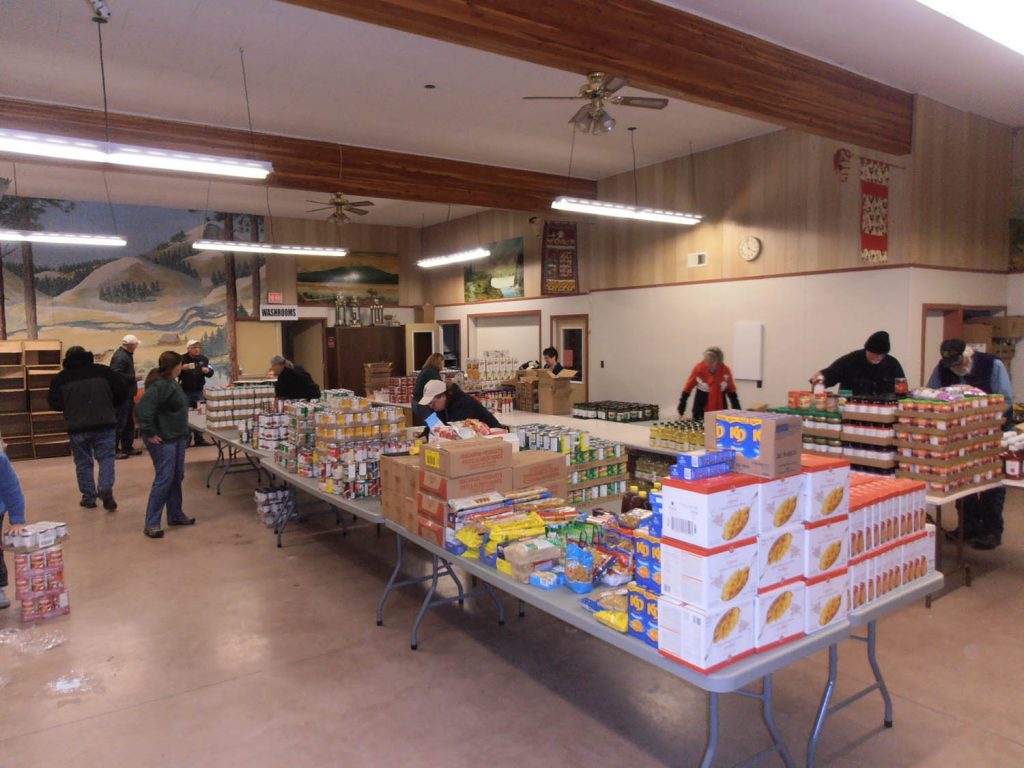 Volunteers with the Kettle River Lions Club were very busy this past weekend as they put together Christmas food hampers for more than 140 families from Rock Creek, Grand Forks, Midway, Bridesville and Greenwood. This year’s program will provide Christmas hampers to more than 140 families across the Boundary region. The majority of food for the hampers was purchased at AG Foods in Osoyoos. Organizers with the Kettle River Lions Club purchased just under $9,000 worth of groceries at AG Foods last Thursday for the hampers. (Contributed photo)