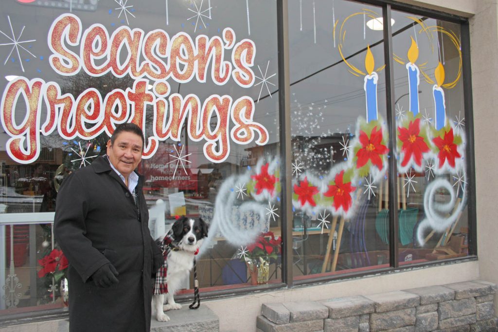 Buckie Bates has enjoyed a terrific 40-year career painting windows and commercial signs and has spent the past couple of years sharing his artistic talent with local business owners, including this sign at the Osoyoos Home Building Centre on Main Street. (Keith Lacey photo)
