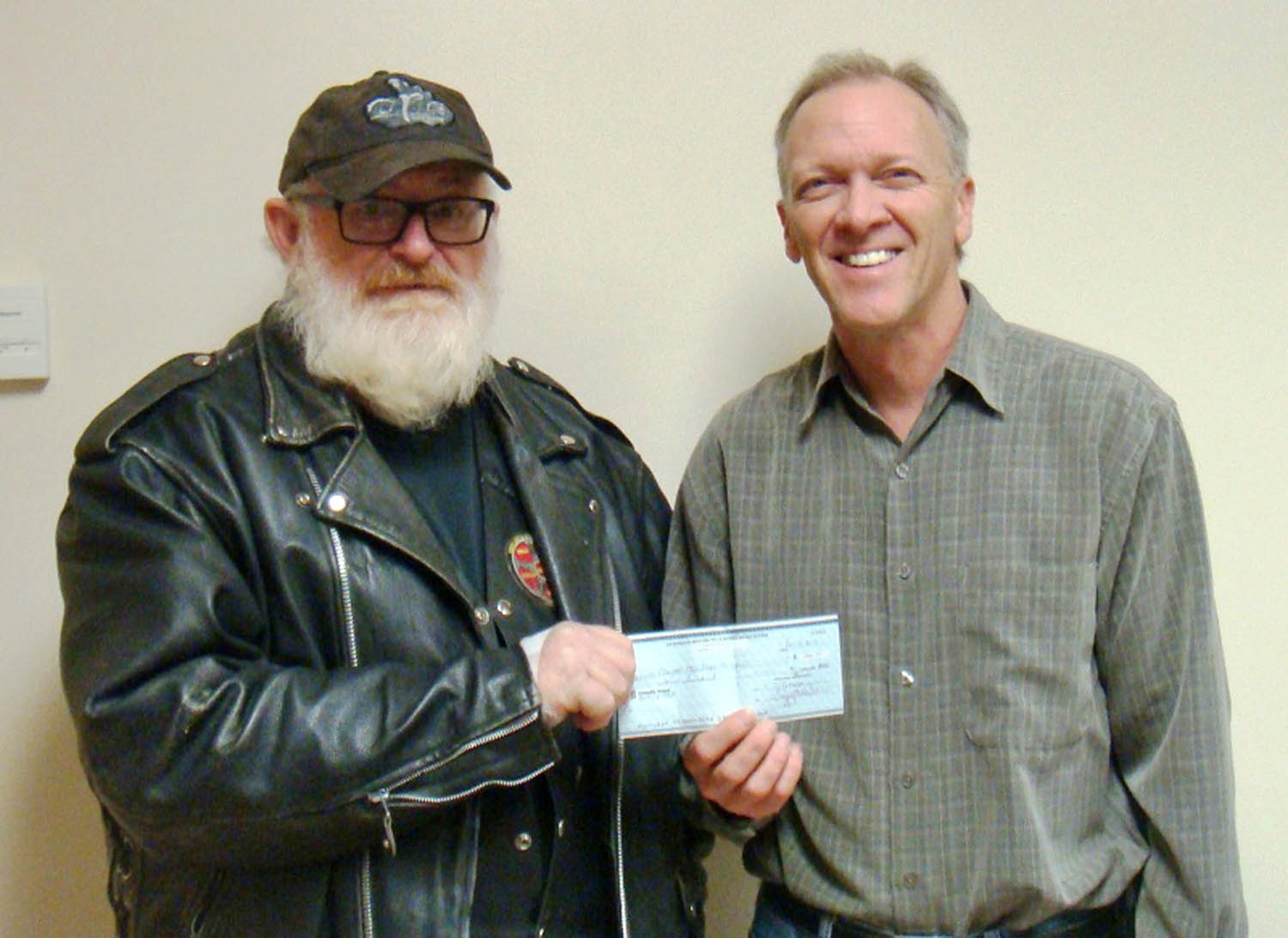 The 90 members of the Okanagan Motorcycle Riders Association (OMRA) held a raffle over the past few weeks to raise money for the Okanagan Similkameen Neurological Society. Tickets are sold with the grand prize being a brand new motorcycle. Some of the proceeds from the raffle are also donated to community organizations. Last week, OMRA president Rod Young presented a $400 cheque to Pastor Phil Johnson of the Osoyoos Baptist Church. The church operates the Osoyoos Food Bank and the $400 will assist the food bank’s annual Christmas Hamper program, which ensures families can enjoy a great Christmas dinner. (Denice Brachmann photo)