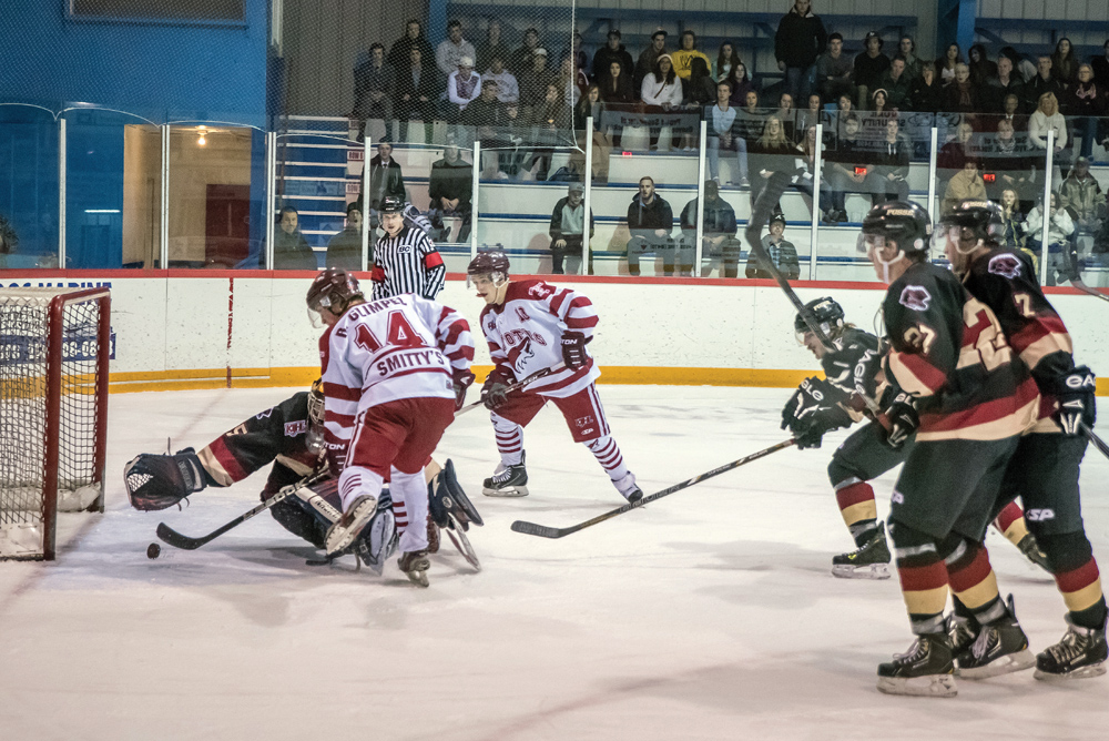 Brett Jewell (right) fires the puck from close range into the back of the net behind 100 Mile House goalie Kristian Stead during a recent game at the Sun Bowl Arena. The Coyotes are the heavy favourites to win the KIJHL championship after losing only seven games in regulation time over the course of the 52-game regular season schedule. The Coyotes begin the playoffs at home against Princeton Posse Friday night. RICHARD McGUIRE