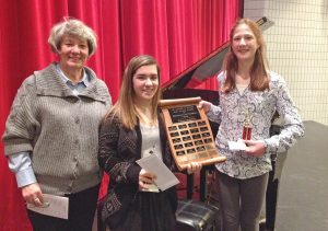 The Osoyoos and District Arts Council has named its latest scholarship winners as a memorial tribute to longtime Osoyoos music teacher Dorothy Fraser. The students receive a plaque, keeper trophy and a scholarship of $100. This year’s winners were Natalia Ibanez-Richer (centre) and Kendra Leinor. They were presented with their awards by Sue Whittaker (left), president of the Osoyoos and District Arts Council. (Photo supplied)