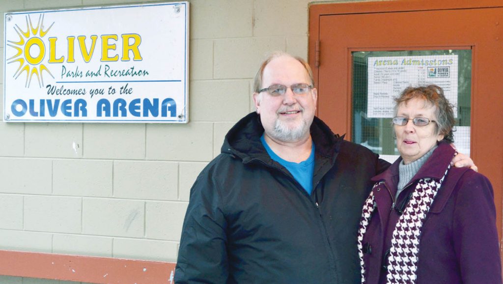 Rae Bardeck is leading the charge to have the Town of Oliver named Kraft Hockeyville 2016. Bardeck is seen standing outside the Oliver Arena with his wife Shirley. Bardeck is urging Oliver residents to get to their computer and cast their ballots in the popular Hockeyville contest. (Trevor Nichols photo)