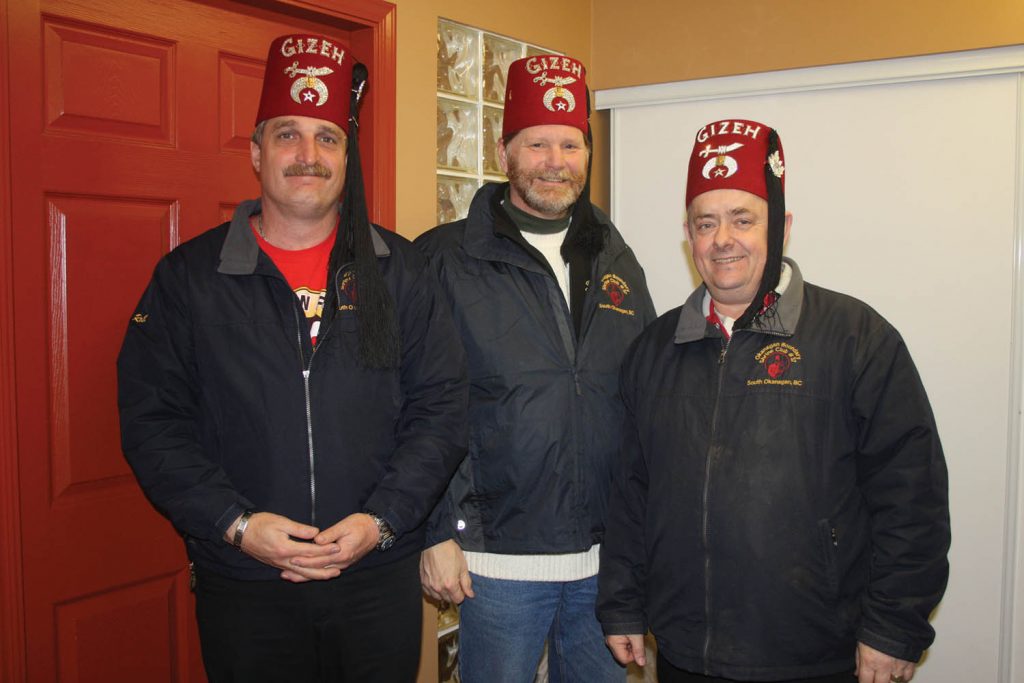 Ray Verbann (far left) is the past president of the Okanagan Boundary Shriners Club, while Peter Beushkens (centre) is the secretary and Trevor Long is current president. The club has been doing good work in Osoyoos and across the South Okanagan since 1971 and is looking to recruit new members. The club is also the game sponsor for Friday’s home game between the Osoyoos Coyotes and Beaver Valley Nitehawks. (Keith Lacey photo)