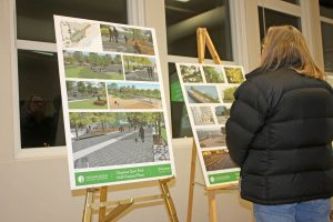 A local woman takes a look at some of the detailed architectural drawings that were produced by Outland Design of Kelowna and presented to a crowd of about 40 local residents at a public hearing relating to the proposed Gyro Park Plaza and other lakefront development upgrades last Thursday evening at the Sonora Community Centre. The proposed plaza would cost more than $600,000 and would probably be built in two phases, with the first phase likely to begin construction this spring. It’s now up to town council to decide on the size, scope and cost for the plaza project. (Keith Lacey photo)