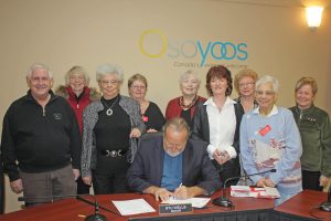 Numerous Osoyoos canvassers with the local chapter of the Heart and Stroke Association gathered at town hall last Friday as Mayor Stu Wells officially proclaimed February as Heart and Stroke Awareness Month in our community. Joining Wells were, front row left to right, Jim Parker, Irene Weis, Cindy Doucette and Sher Dastoor. Back row, left to right, are Elaine Clarke, Annette Star, Nancy Weather, Rosemarie Gosling and Roberta Lowther. (Keith Lacey photo)