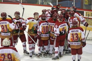 Members of the Osoyoos Coyotes surround goalie Lawrence Langan at the end of their 7-3 victory Friday night against the North Okanagan Knights. The victory also saw Rainer Glimpel score a hat trick, including two goals while the Coyotes were short handed. The Coyotes didn’t do as well in their final game of the regular season when they went down to an 8-4 defeat to the Steam in Summerland on Saturday. The Steam has had an exceptionally good season finish and will be playing the Knights in their series. If Osoyoos wins the series with Kelowna, they could face the Steam once again.  (Keith Lacey photo)