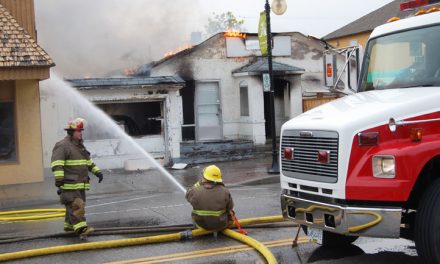 Passerby helps family escape house fire