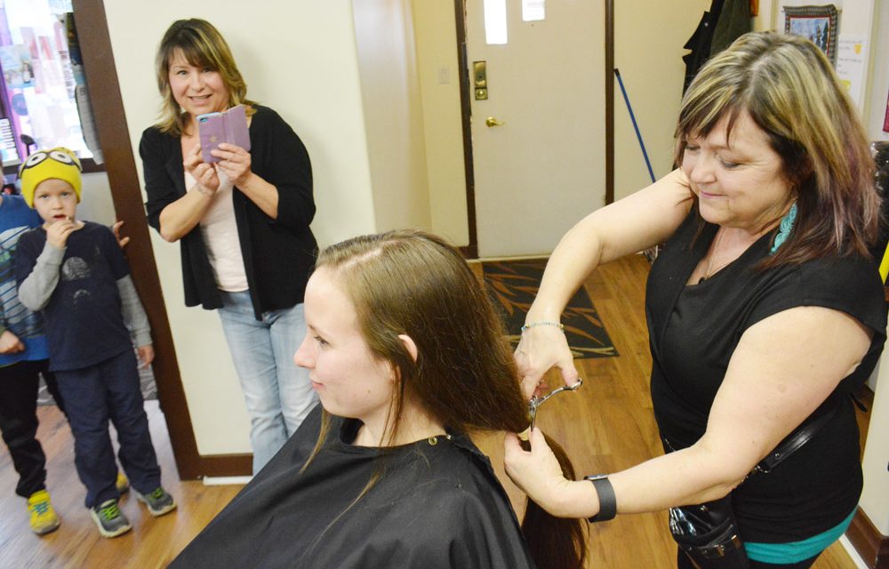 Woman donates locks for cancer patients