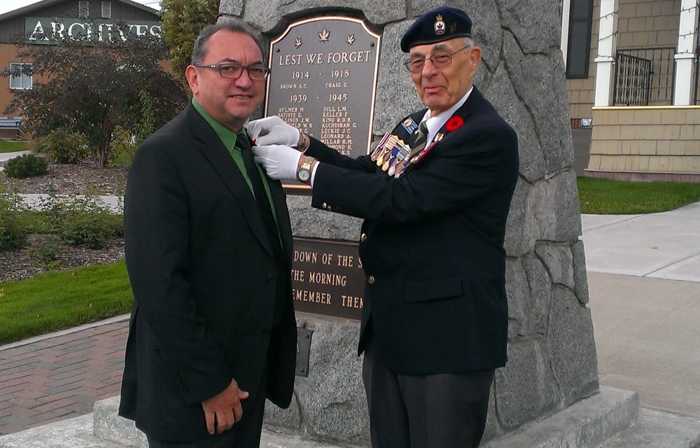 First poppy pinned on Town of Oliver Mayor Ron Hovanes