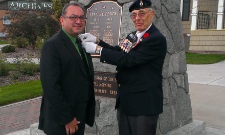 First poppy pinned on Town of Oliver Mayor Ron Hovanes