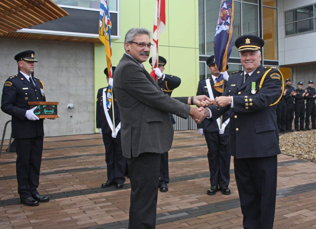 B.C. Solicitor General Mike Morris hands over the keys for the new Okanagan Correctional Centre to Warden Steve diCastri. (Keith Lacey photo)