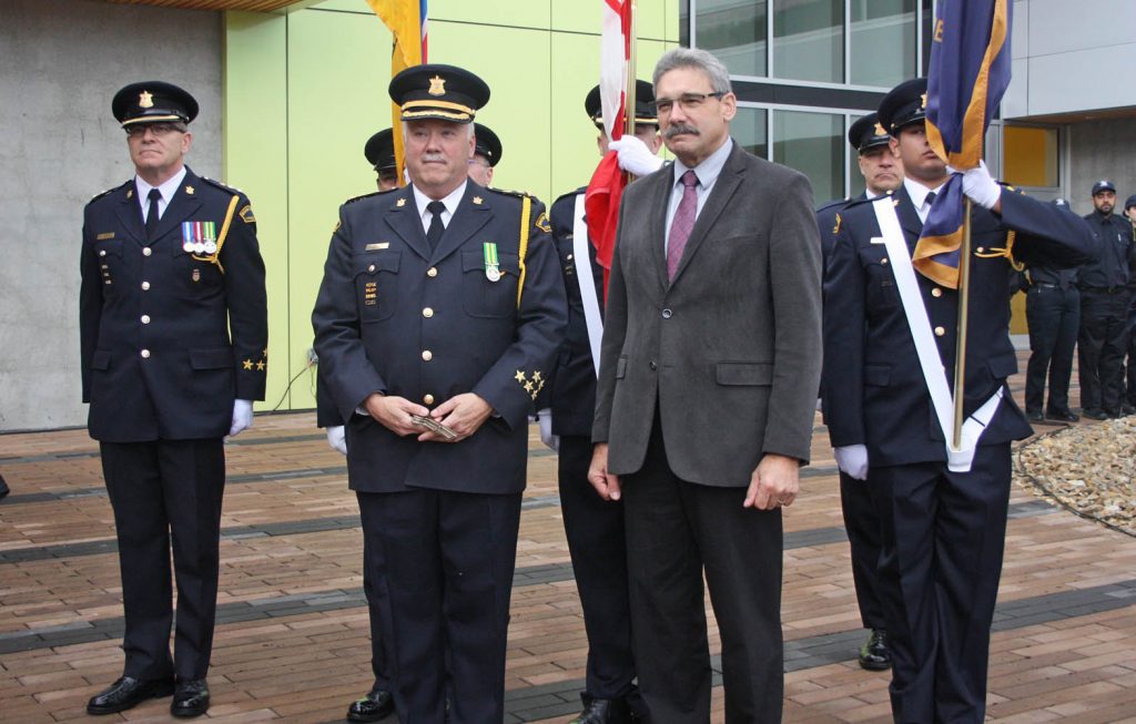 Warden Steve diCastri and B.C. Solicitor General Mike Morris are surrounded by a colour guard at the opening ceremony for the new Okanagan Correctional Centre. (Keith Lacey photo)