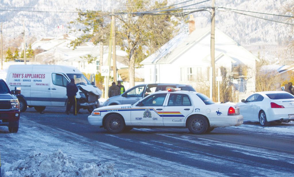 The intersection of 87th Street and 78th Avenue, just off Main Street in Osoyoos, was blocked off for about an hour early last Friday afternoon after this collision between a work van that was turning left onto 78th Avenue and an oncoming motor vehicle. Emergency crews were on the scene quickly and no one appeared to have been seriously injured in the collision. (Keith Lacey photo)