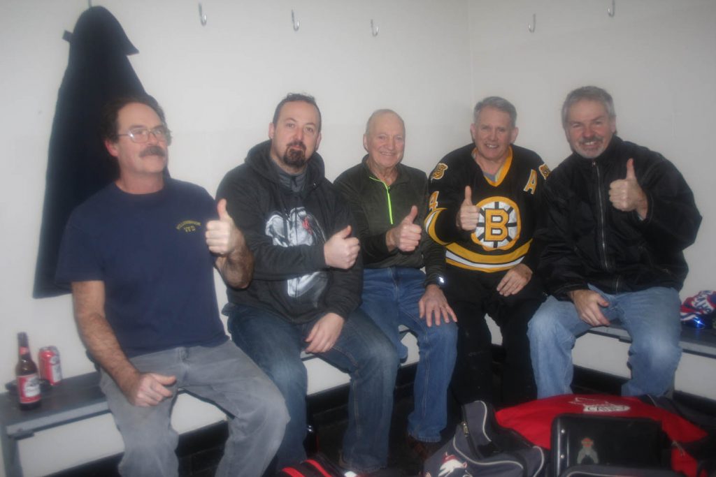 Harold Cox (centre) celebrated his 77th birthday last Friday by playing hockey with the regular Friday morning gang at the Oliver Arena. Three years ago Cox nearly died when he suffered a massive heart attack on the ice. Five of his hockey buddies raced into action conducting CPR and using an AED to shock his heart. Cox purchased beer and pizza for the boys to celebrate the occasion. The players and friends who helped save Cox’s life include (from left) Doug Hume, Jeff Crowley, Bryan Coles and Marthy Whiteman. Steve Arstad no longer lives in Oliver. (Keith Lacey photo)