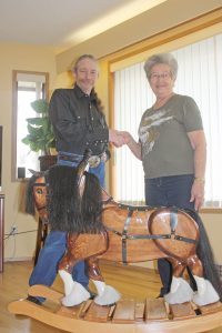For the seventh consecutive year, the Osoyoos Soroptomists sold tickets for a beautiful wooden rocking horse to help raise funds for the many programs the organization supports in Osoyoos. The club raised $2,500 through ticket sales. Doris Walton, chair of the rocking horse committee, presented the winning prize to this year’s winner Dan Burton on Monday afternoon. Proceeds will go towards a local women’s and children’s shelter. (Keith Lacey photo)