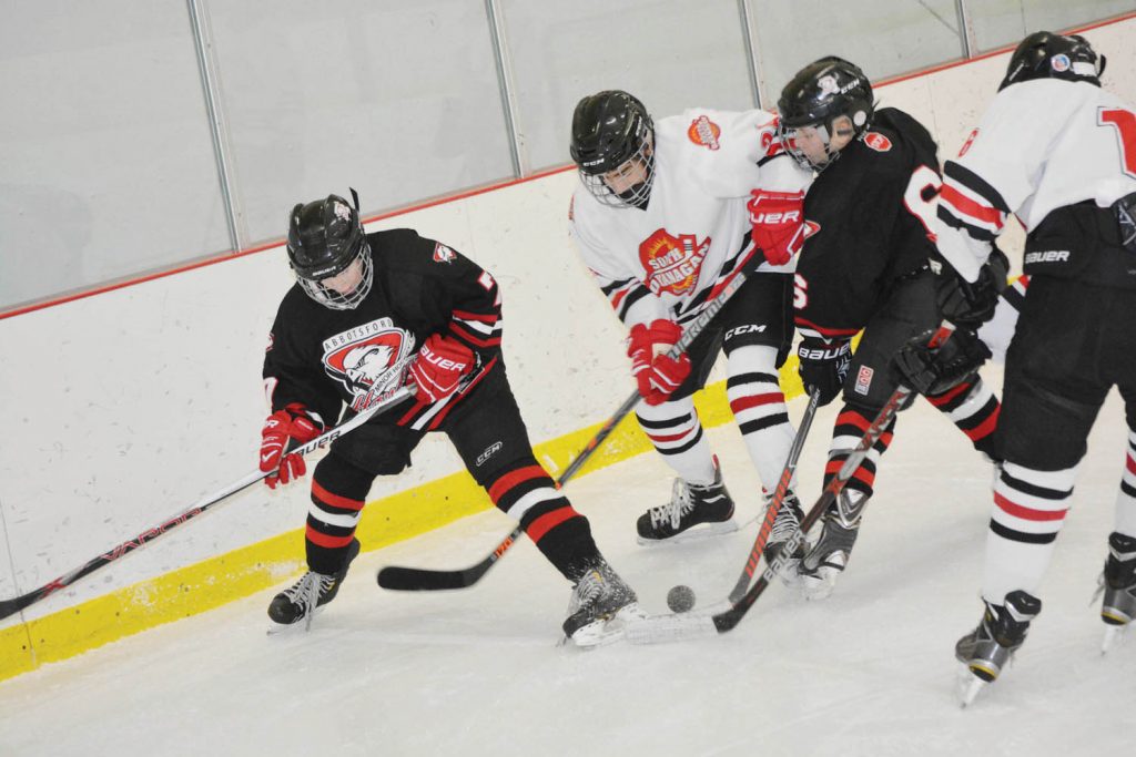 The South Okanagan Minor Hockey Association Bantam Rec team (in white) played hard but came up with mixed results in last weekend’s tournament. Here, the team battles Abbotsford in a game they lost 7-3. It lost its next game to Summerland 4-2, but beat Merritt 6-1 and Logan Lake 5-3. Langley won the tournament, defeating Abbotsford 9-3 in the championship final game. (Lyonel Doherty photo)