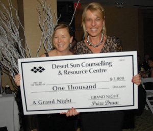 Marieze Tarr, chair of the local school district board of directors, was the big winner of the $1,000 top prize and was awarded the cheque by Desert Sun board member Sandy Summers. (Russell Work Photos)