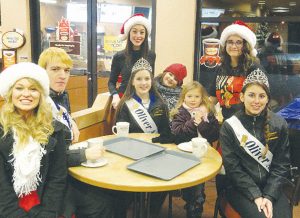 Members of the Osoyoos Royalty had a busy holiday season attending numerous events, including the annual Christmas Lite-Up and Parade in Osoyoos. Royalty members, including Queen Gina Pereira (centre standing), Carmen Olsen (far left) and Viveka Jensen (second from right) are shown with their “little buddies” Hali Steiner and Alesia Dortman, along with the Oliver Ambassadors after the Lite-up Parade. (Photo supplied)