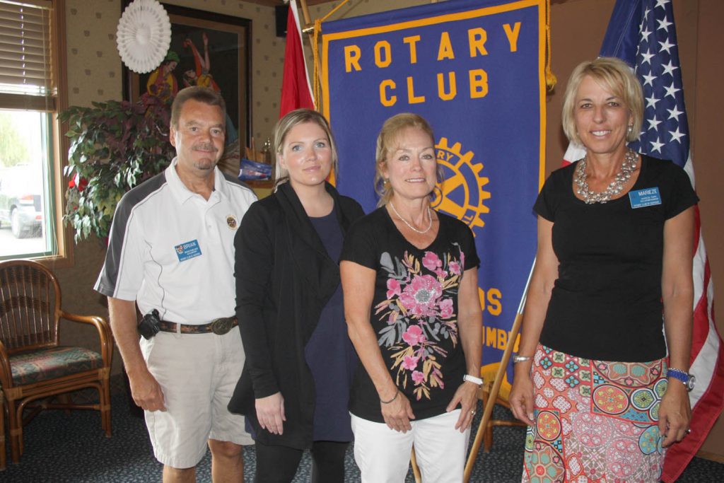 Brittany von Burg (second from left), program co-ordinator with Better at Homes, which assists seniors in Osoyoos and Oliver with services that allow them to remain in their homes longer, made a presentation to the Rotary Club of Osoyoos last week. Von Burg is seen with new club president Brian Rawlings, outgoing president Marieze Tarr (far right) and Better at Homes social worker in training Cheryl Martin. (Keith Lacey photo)