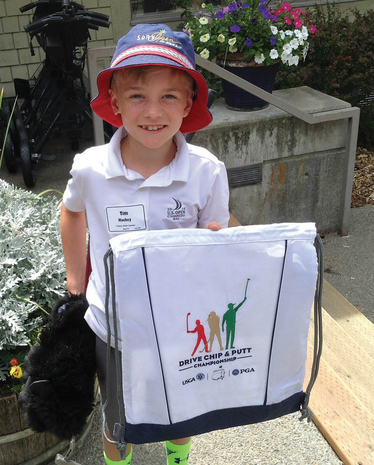 Timmy Hachey, 8, shows off one of the prizes he captured for winning his age division in the Drive, Chip and Putt competition in Spokane. He’s off to Oregon next month for regionals. (Photo supplied)