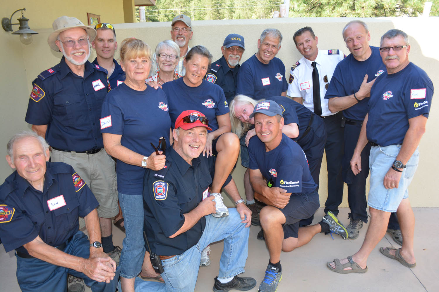 Members of the Anarchist Mountain Fire Department have fun with a group photo during their fundraising barbecue at the Summit Centre on July 12. More than 100 people attended the seventh annual AMFD fundraising barbecue and helped raise more than $6,000 for the department. (Lyonel Doherty photo)