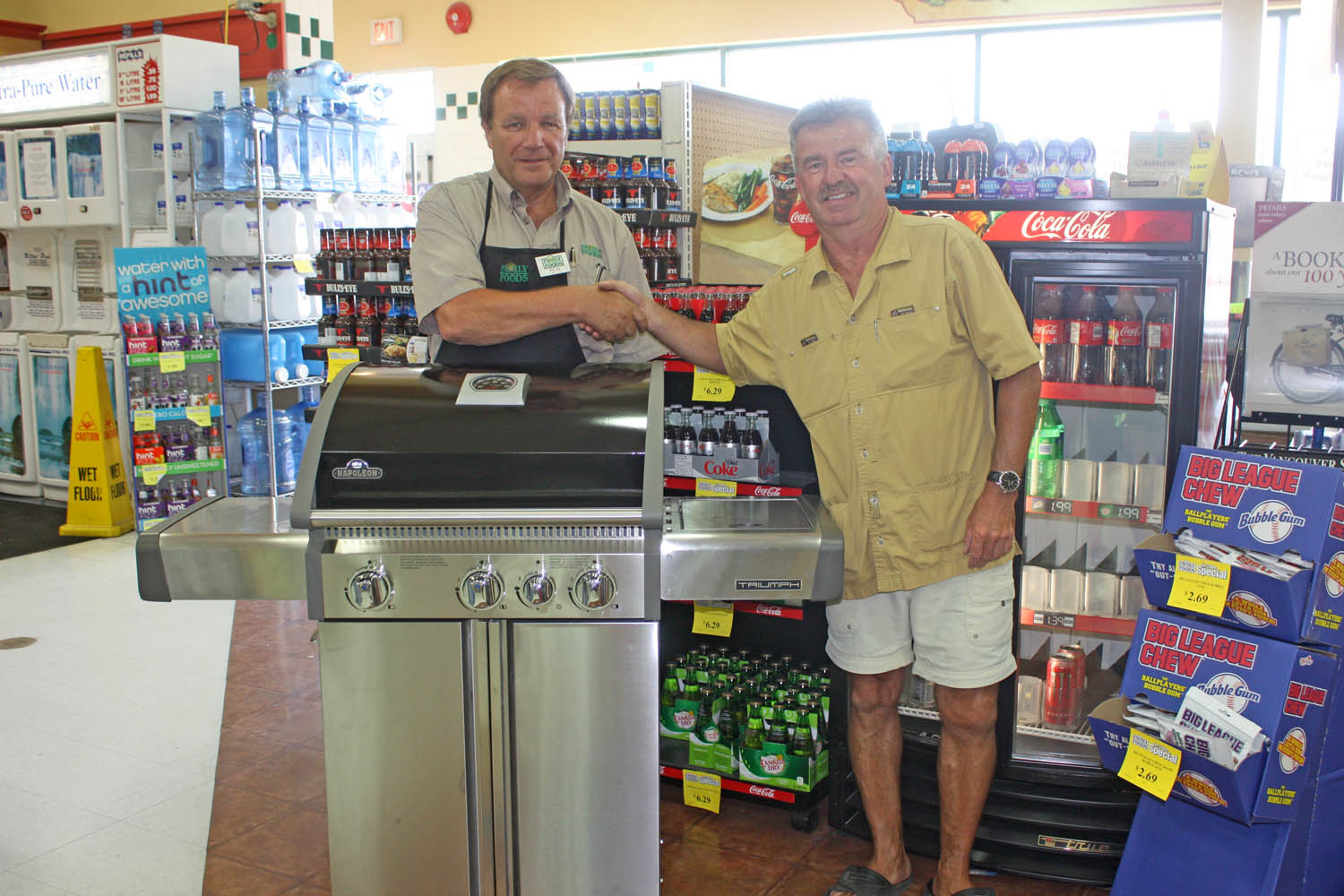 For the past several years, Osoyoos Family Foods has been holding a draw every summer to award a new bicycle and barbecue to loyal customers. Pictured here, Grocery Manager Bob Irwin presented a new barbecue to Osoyoos resident Peter Kruszewski. (Keith Lacey photo)