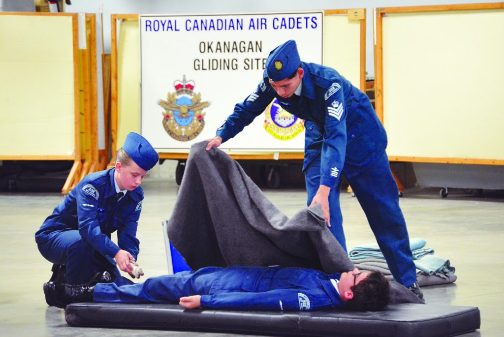 Members of the 232 Bighorn Squadron participated in their annual Royal Canadian Air Cadets Annual Ceremonial Review this past Sunday at their headquarters in Oliver. Above, members show off their First Aid skills during a live demonstration. Many of the young air cadets go on to obtain their pilot’s licences. (Dan Walton Photo).