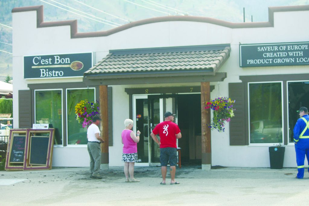 An early morning fire on Thursday gutted the interior of the new C'est Bon Bistro, located in the Cottonwood Plaza on Main Street in Osoyoos. Volunteers remained on the scene at 9 a.m., four hours after crews were dispatched to the scene. (Keith Lacey photo)