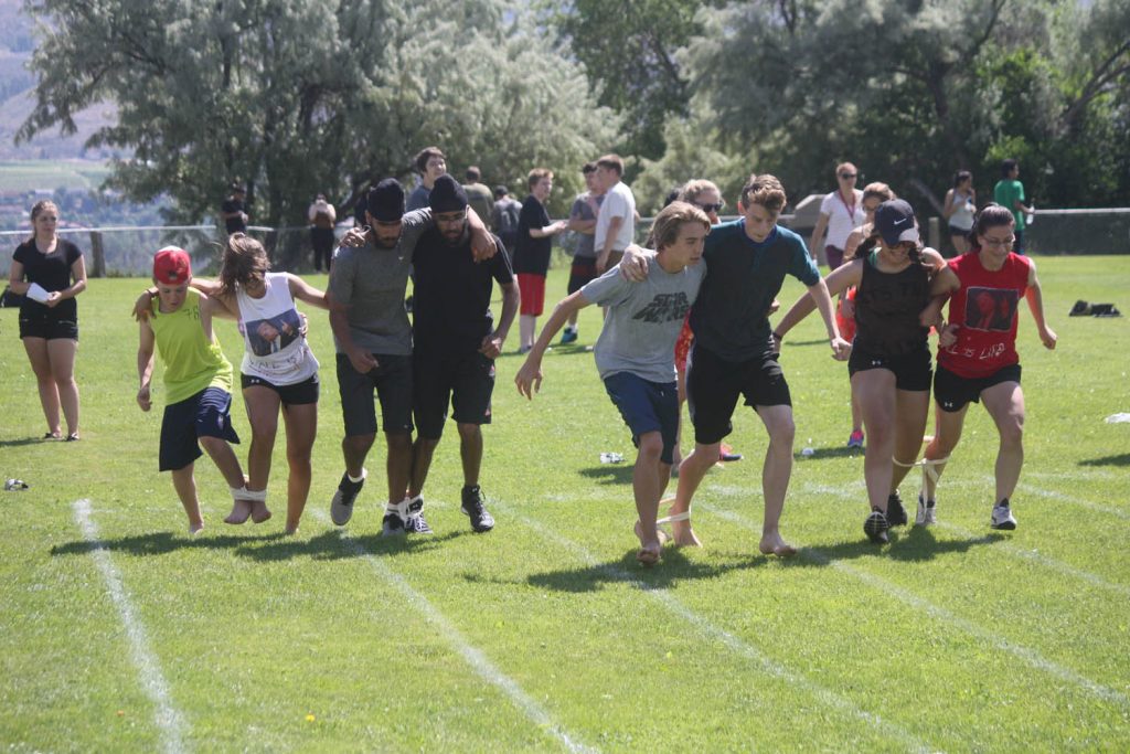 Osoyoos Secondary School students compete in a three-legged race last Thursday during the Storm the Wall event. (Keith Lacey photo)