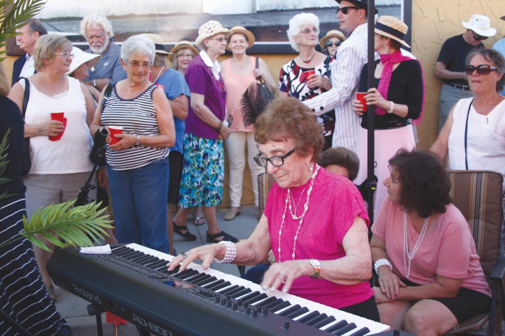 Virginia Macdonald, the sister of store owner Frances Sologuk, entertained by playing a few tunes on the piano. (Keith Lacey photo)