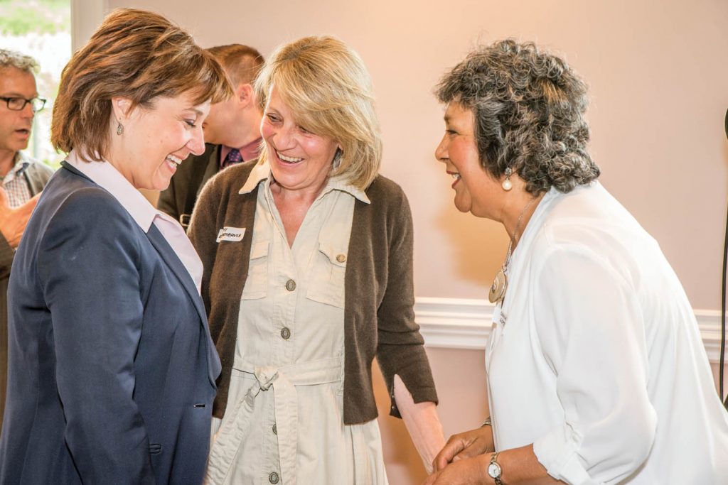 Premier Christy Clark (left) shares a laugh with Cathy Behrenbruch and Sonia Lopez, both from Osoyoos. The premier spoke at a lunch event organized by the South Okanagan Chamber of Commerce at Silver Sage Winery last Thursday. During her visit, she couldn't get away from the national park issue, as people on both sides lobbied and questioned her. (Richard McGuire photo)