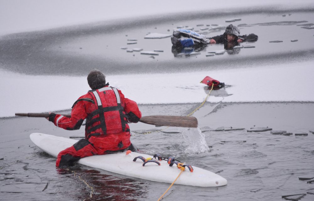 Boy saved after falling through thin ice on lake