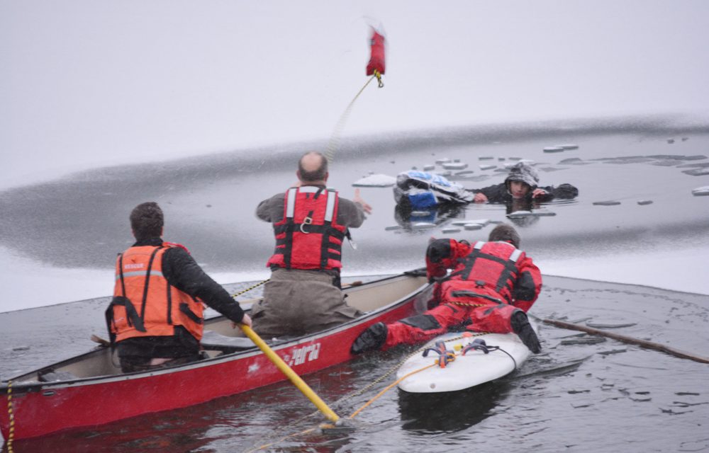 Youth pulled from lake after falling through ice