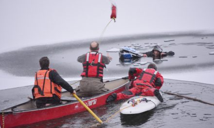 Youth pulled from lake after falling through ice
