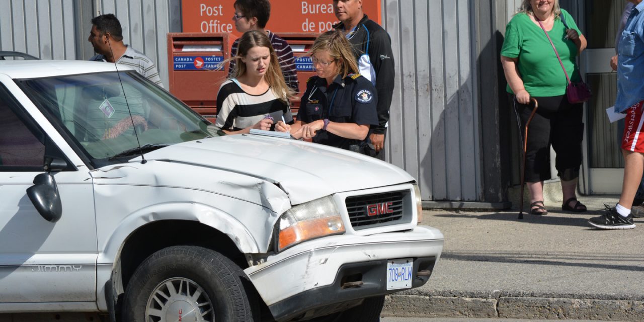 Two-vehicle collision in front of post office
