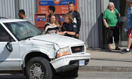 Two-vehicle collision in front of post office