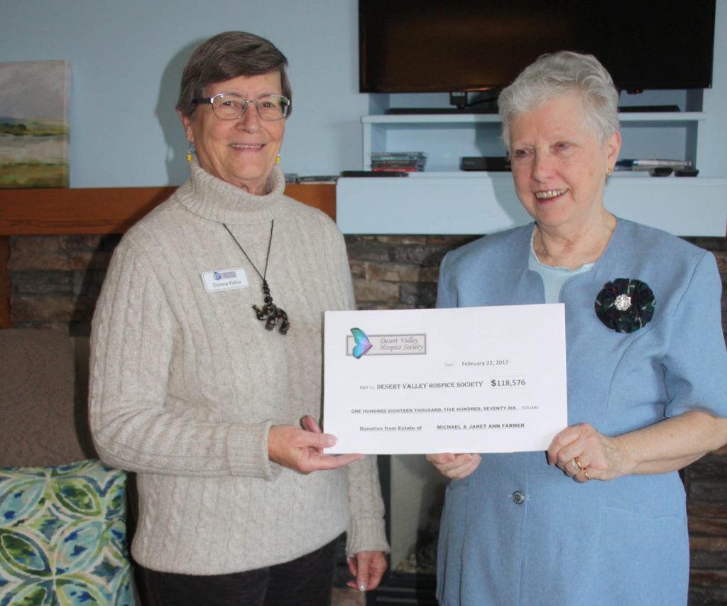 Fiona Wood, the executor for the estate of Michael and Janet Farmer, last week handed over a cheque for more than $118,000 to the Desert Valley Hospice Society. Accepting the cheque on behalf of the hospice society was board member Donna Kelso. The Farmers also donated the same amount to the South Okanagan branch of the BCSPCA as well as the Salvation Army. (Keith Lacey photo)